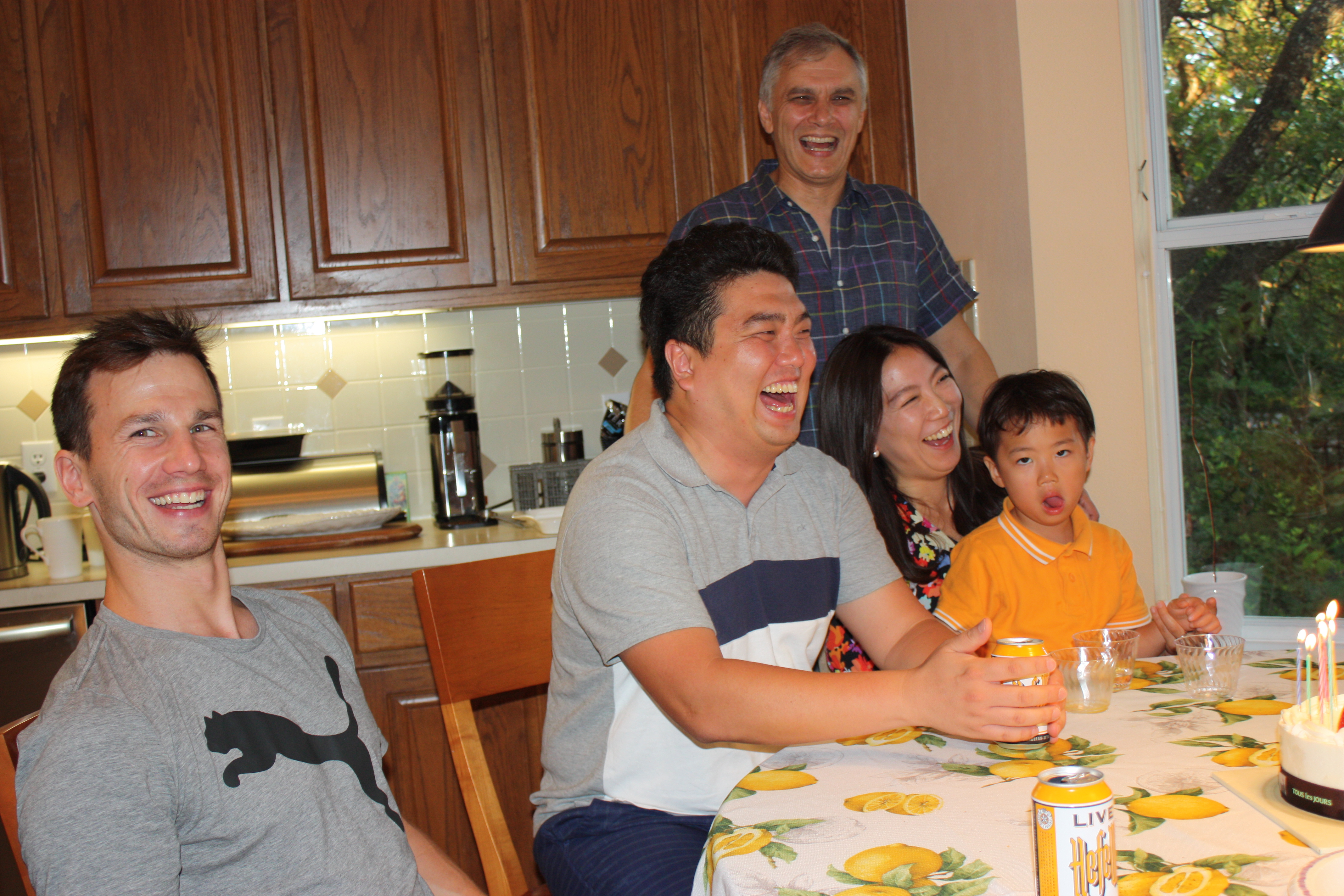 Donghan, his family, Tobi, and Alex laughing.